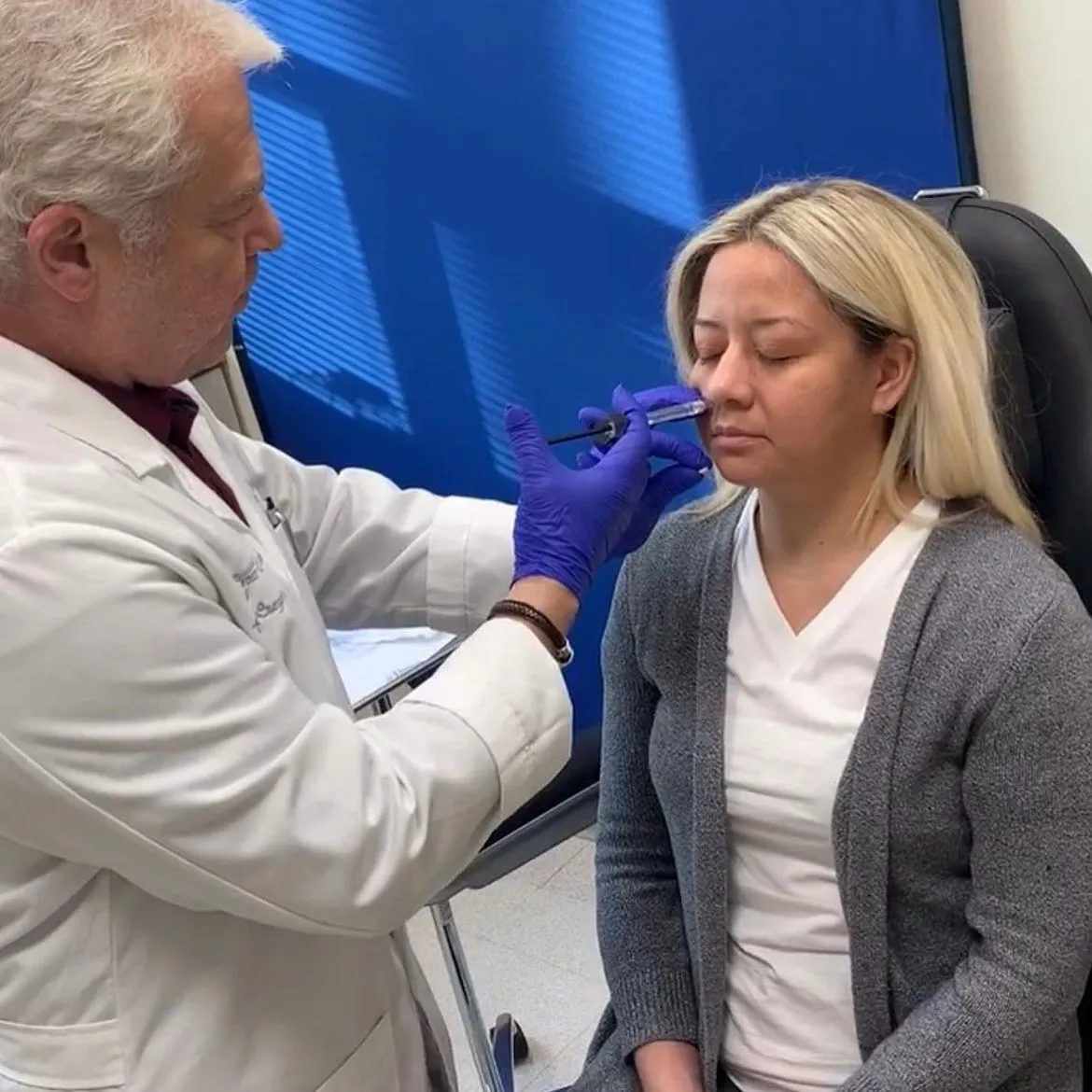 Dr. Boris Mordkovich administering Avéli cellulite treatment to a patient's face at Cross Hudson Plastic Surgery in Fort Lee, NJ